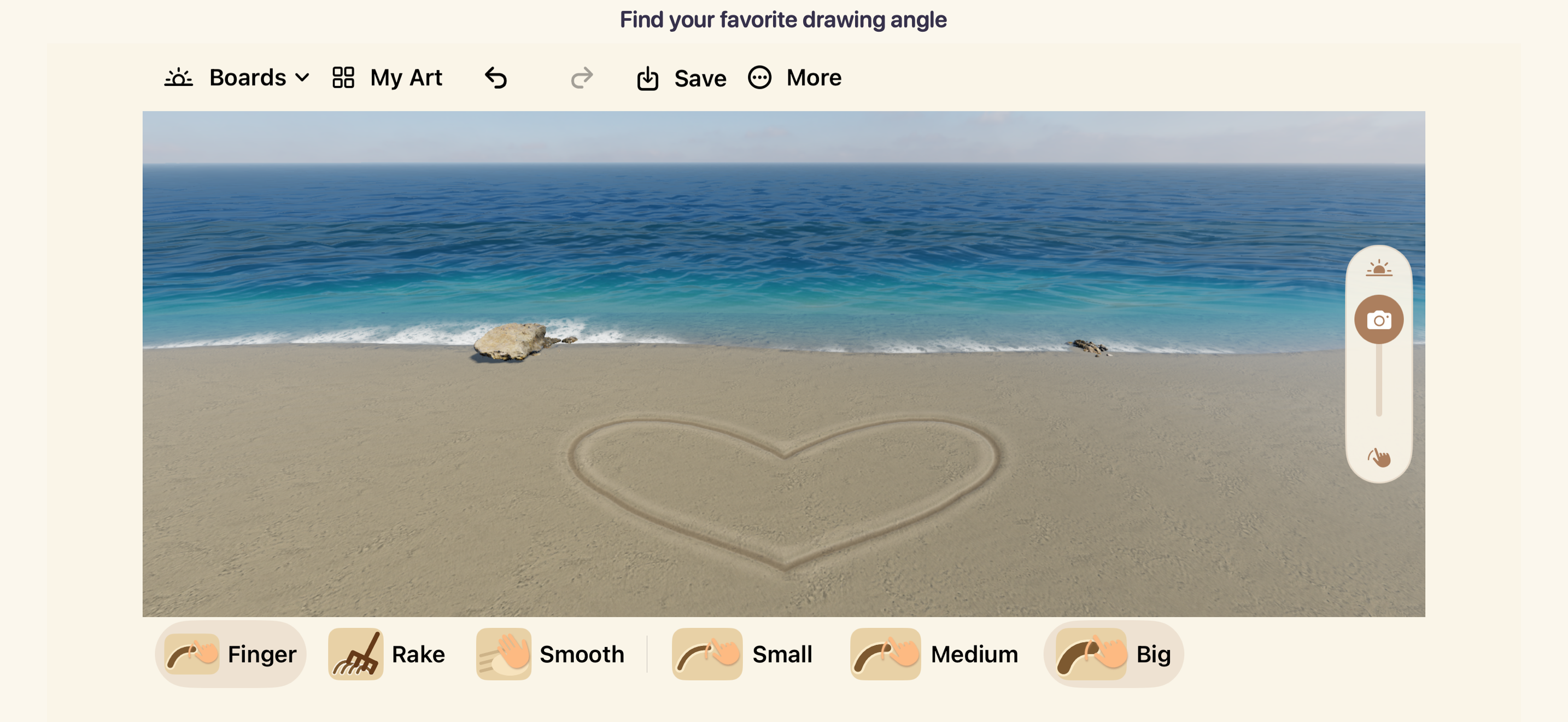 A closer camera view of the heart carved in beach sand